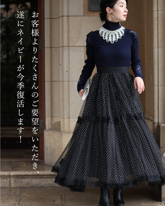 A turtleneck knit top with beautifully transparent lace on the shoulders and sleeves