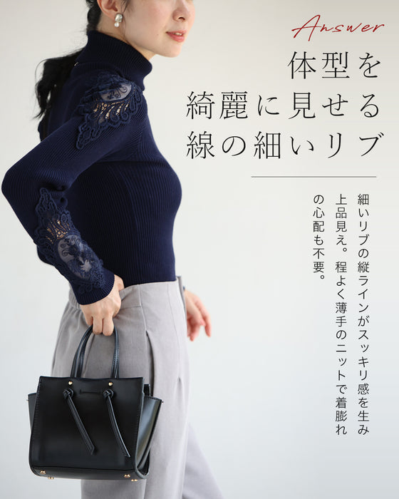 A turtleneck knit top with beautifully transparent lace on the shoulders and sleeves