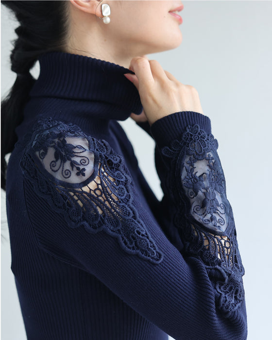 A turtleneck knit top with beautifully transparent lace on the shoulders and sleeves