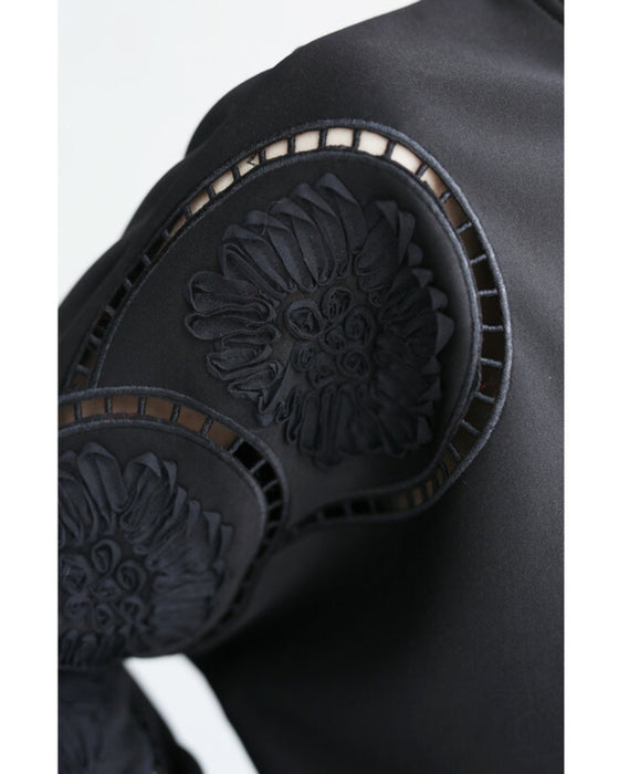 Glossy pullover top with floral relief sleeves