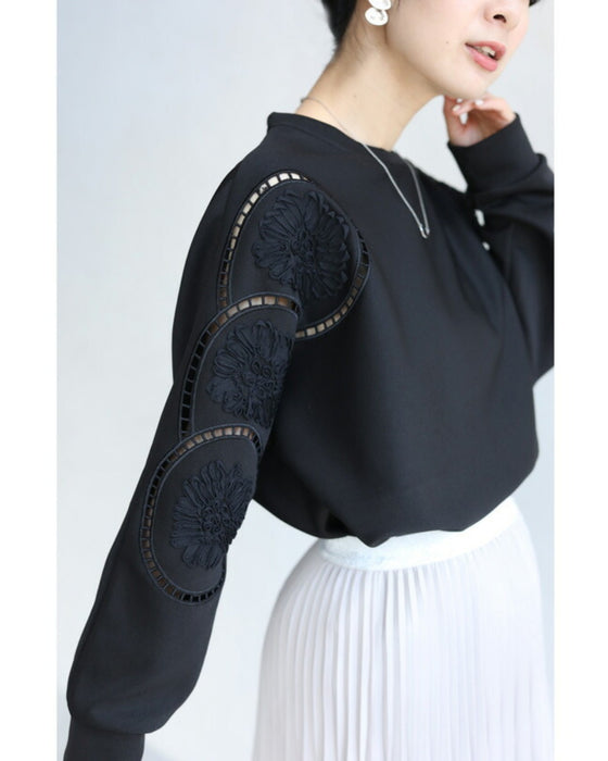 Glossy pullover top with floral relief sleeves