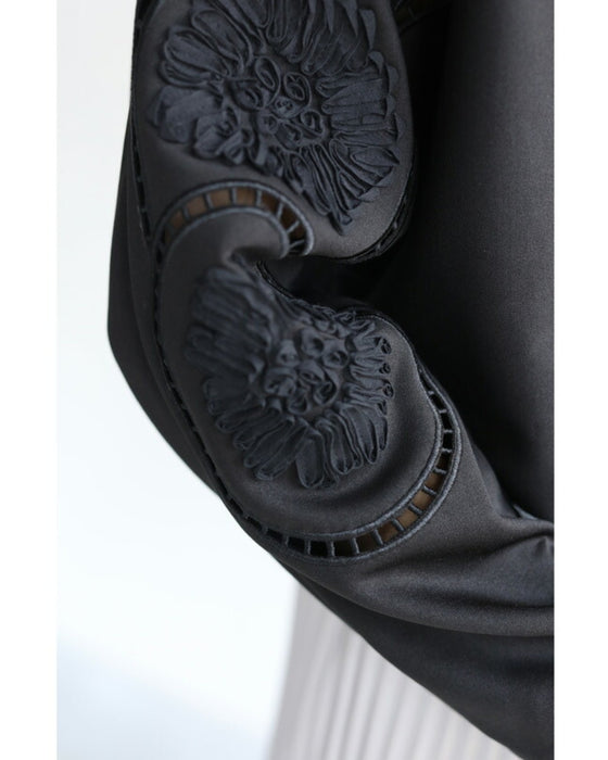 Glossy pullover top with floral relief sleeves