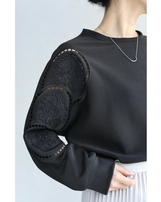 Glossy pullover top with floral relief sleeves