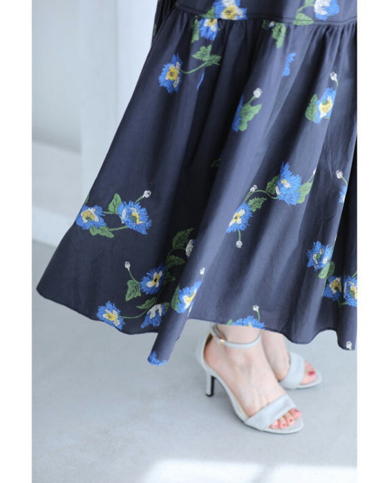 A fluffy mid-length skirt with a lovely blue flower design