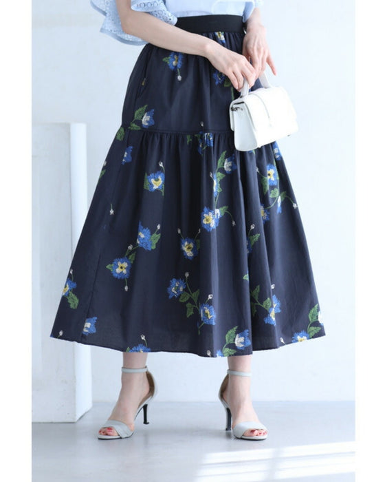 A fluffy mid-length skirt with a lovely blue flower design