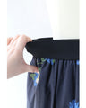 A fluffy mid-length skirt with a lovely blue flower design