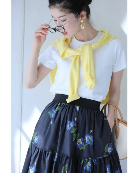 A fluffy mid-length skirt with a lovely blue flower design