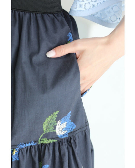 A fluffy mid-length skirt with a lovely blue flower design