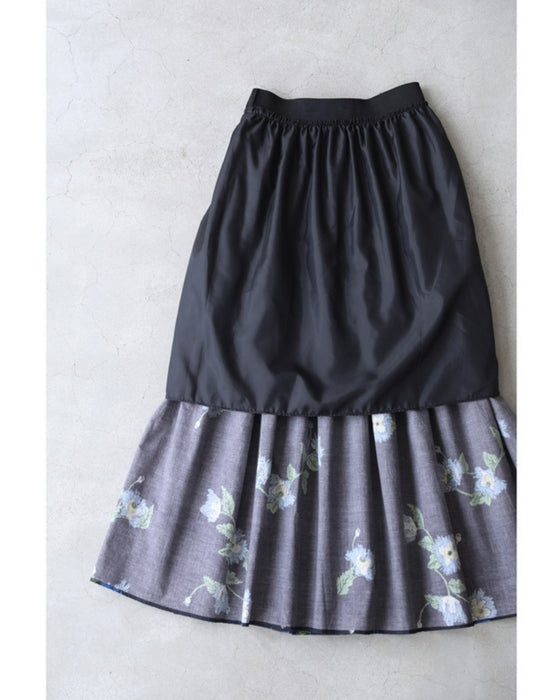 A fluffy mid-length skirt with a lovely blue flower design