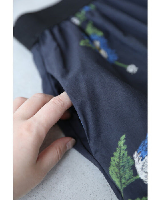 A fluffy mid-length skirt with a lovely blue flower design