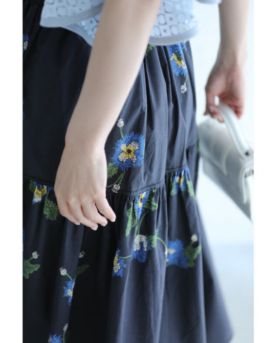 A fluffy mid-length skirt with a lovely blue flower design