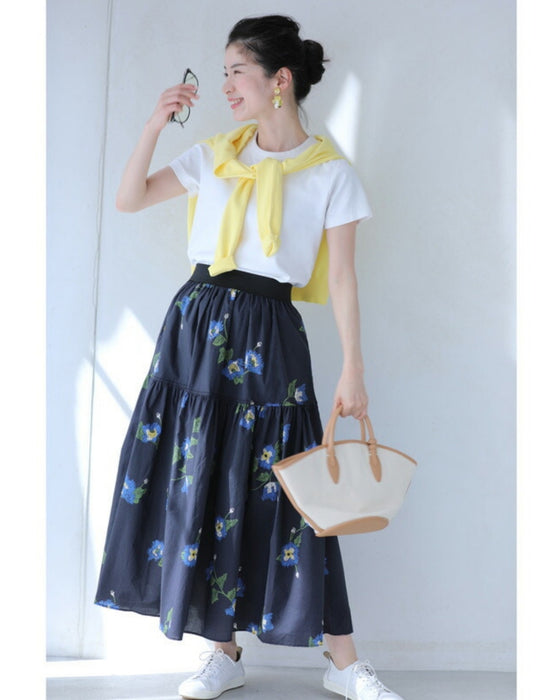 A fluffy mid-length skirt with a lovely blue flower design