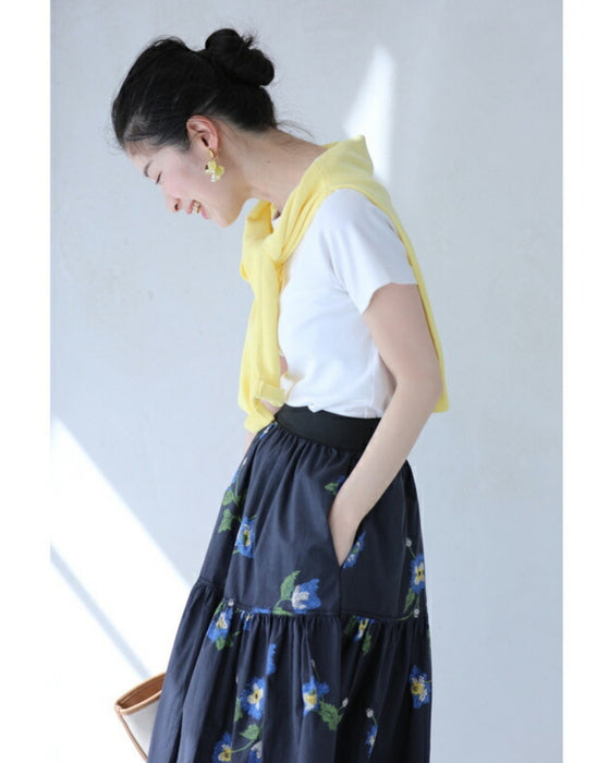 A fluffy mid-length skirt with a lovely blue flower design