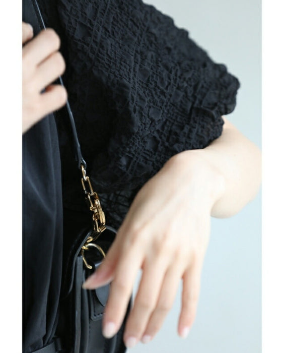 ぽこぽこ浮き立つ柄のふんわり袖Aラインチュニック