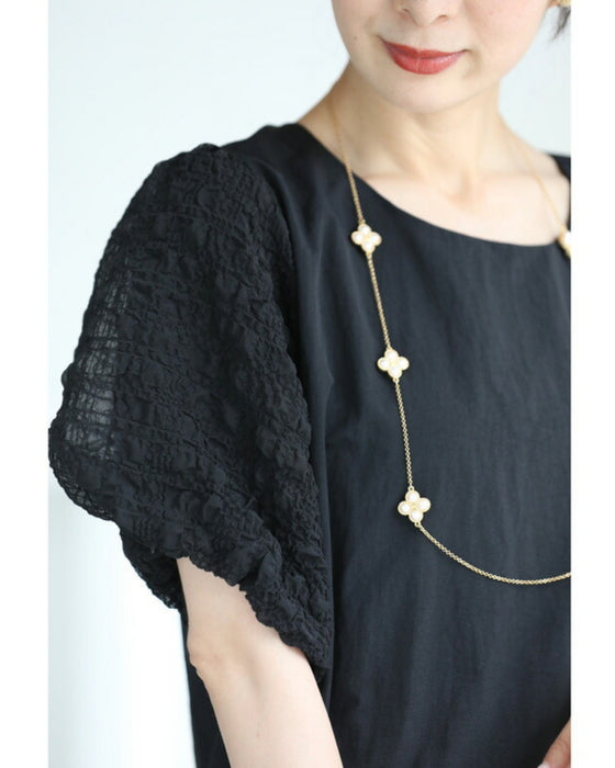 ぽこぽこ浮き立つ柄のふんわり袖Aラインチュニック