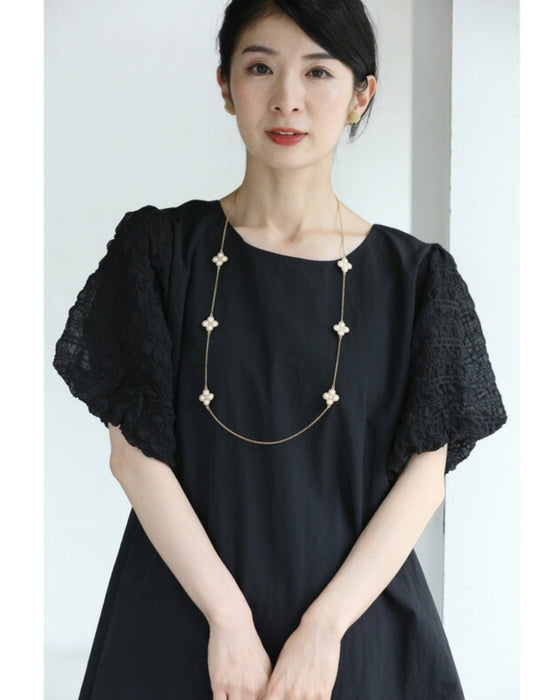 ぽこぽこ浮き立つ柄のふんわり袖Aラインチュニック