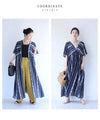 Can also be worn as a jacket. A long dress with a swaying floral pattern