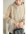 A light jacket with a hood made of beautiful cutwork lace