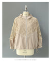 A light jacket with a hood made of beautiful cutwork lace