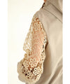A light jacket with a hood made of beautiful cutwork lace