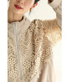 A light jacket with a hood made of beautiful cutwork lace