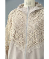 A light jacket with a hood made of beautiful cutwork lace