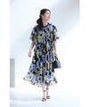 A sheer floral mid-length dress with pleats that flares out from the neck