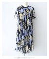 A sheer floral mid-length dress with pleats that flares out from the neck