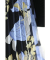 A sheer floral mid-length dress with pleats that flares out from the neck