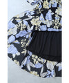 A sheer floral mid-length dress with pleats that flares out from the neck