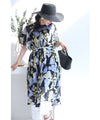 A sheer floral mid-length dress with pleats that flares out from the neck