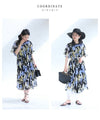 A sheer floral mid-length dress with pleats that flares out from the neck
