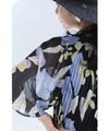 A sheer floral mid-length dress with pleats that flares out from the neck