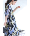 A sheer floral mid-length dress with pleats that flares out from the neck