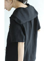 Traditional jacket with gold buttons and a sailor collar and shoulder pads