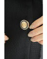 Traditional jacket with gold buttons and a sailor collar and shoulder pads