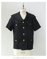 Traditional jacket with gold buttons and a sailor collar and shoulder pads