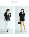 Traditional jacket with gold buttons and a sailor collar and shoulder pads