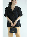 Traditional jacket with gold buttons and a sailor collar and shoulder pads