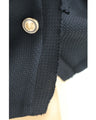Traditional jacket with gold buttons and a sailor collar and shoulder pads