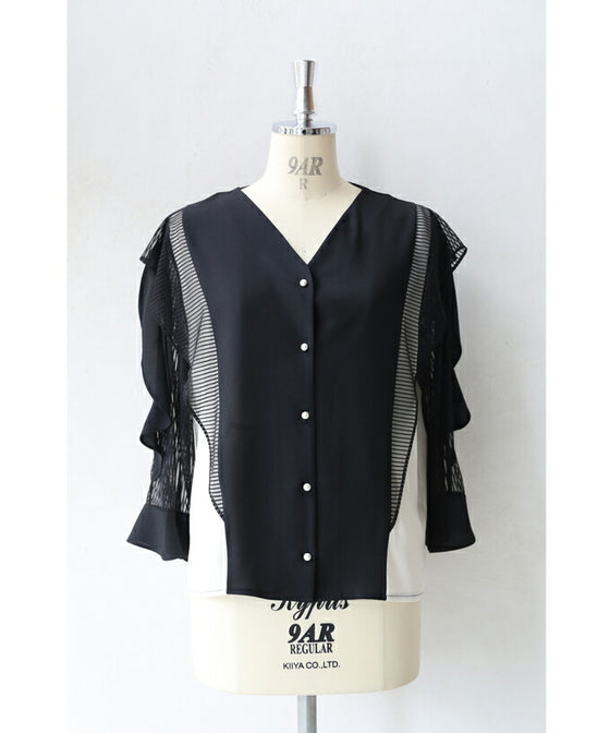 Two-tone blouse top with flowing ruffles and sheer striped sleeves