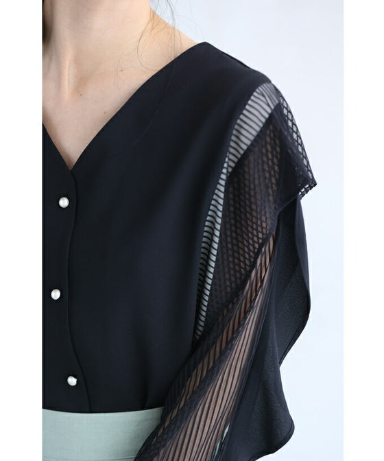 Two-tone blouse top with flowing ruffles and sheer striped sleeves