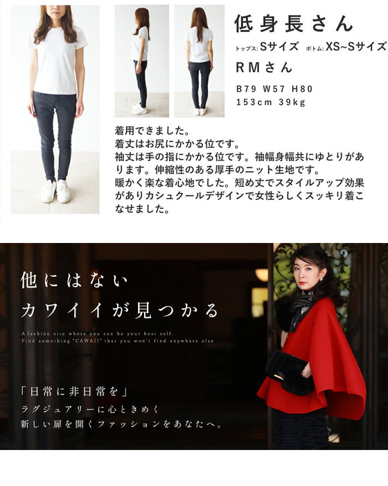 A knit pullover top with a black and white cache-coeur design