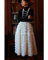 A voluminous bouquet skirt wrapped in rose flowers
