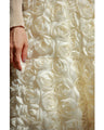 A voluminous bouquet skirt wrapped in rose flowers
