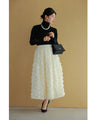 A voluminous bouquet skirt wrapped in rose flowers