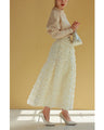 A voluminous bouquet skirt wrapped in rose flowers