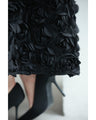 A voluminous bouquet skirt wrapped in rose flowers