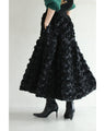 A voluminous bouquet skirt wrapped in rose flowers
