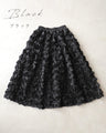 A voluminous bouquet skirt wrapped in rose flowers